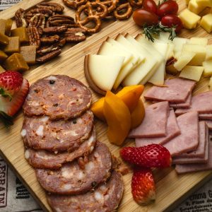 Appetizing charcuterie board featuring meats, cheeses, fruits, and nuts, perfect for gatherings.